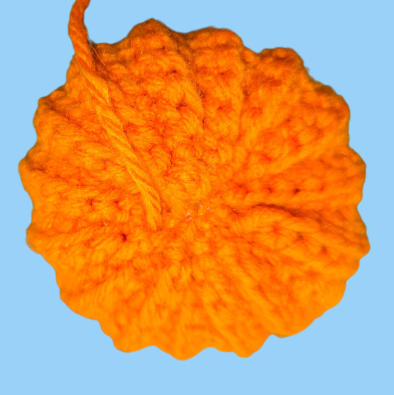 Striped crochet pumpkin in progress
