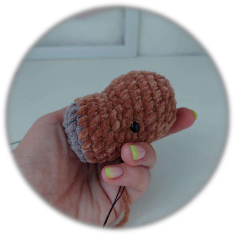 Head with embroidered facial details