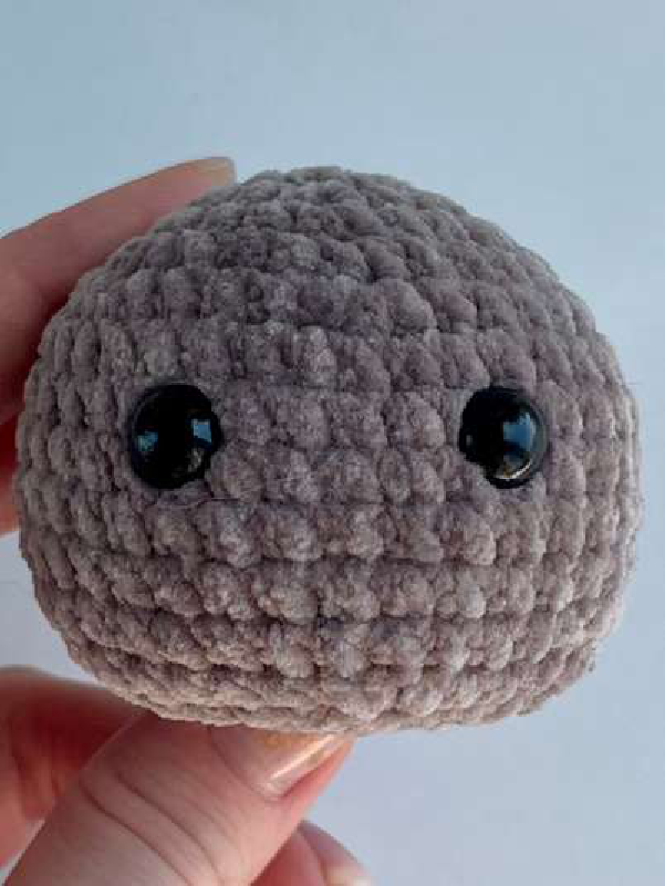 Side view of bear head with safety eyes inserted