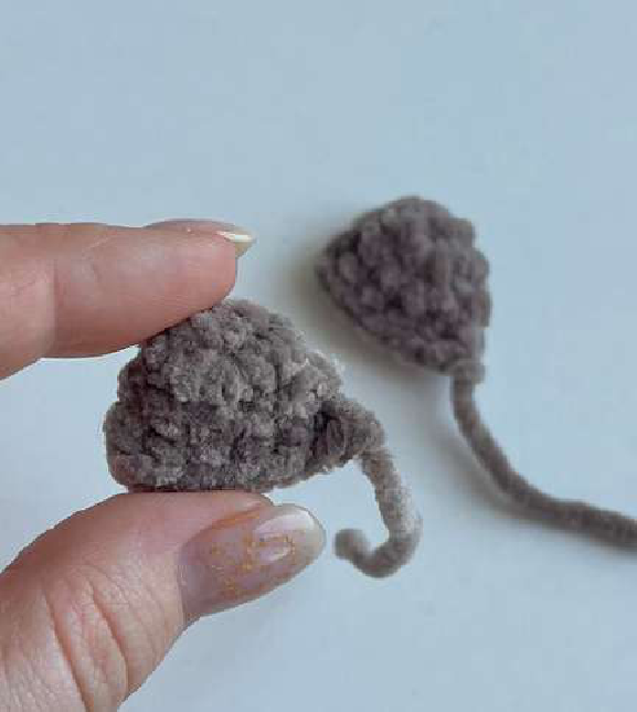 Two crocheted ear pieces for the bear