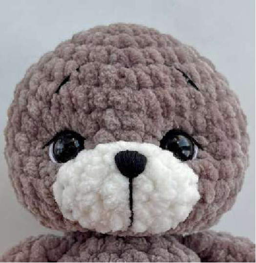 Finished assembled mini bear with full embroidered face