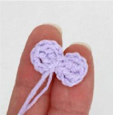 Crochet doll wearing skirt and top