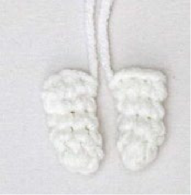 Crochet bunny head with embroidered face