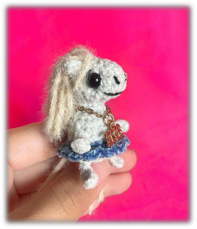 Close up of various Igogoshka crochet horses