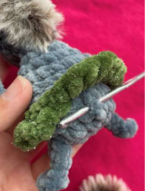 Completed tail on the Igogoshka crochet doll