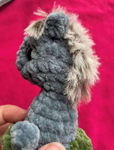 Attaching fur yarn to create the tail.