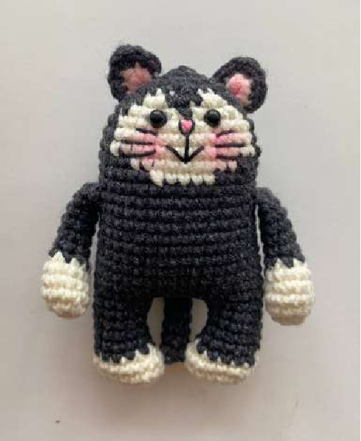 Group shot of finished crocheted bear, bunny, and cat faces