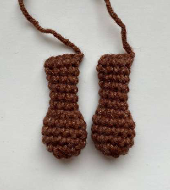 Close-up of crocheted arm in progress