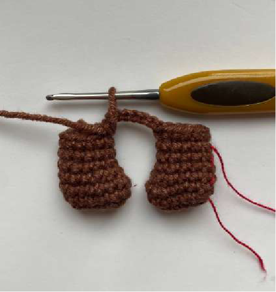 Crocheted leg in progress with stitches visible