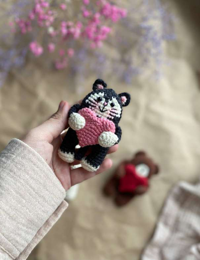 A knitted cat figure