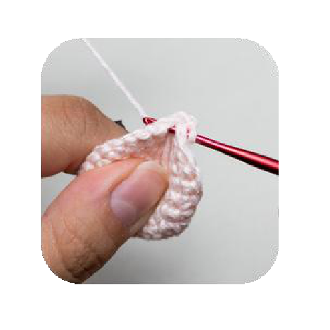 Cutting excess yarn after head attachment