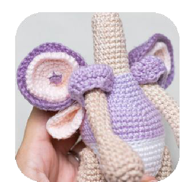 Both wings sewn to doll's back