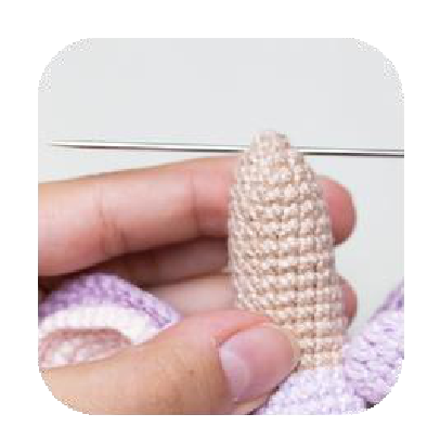 Guiding yarn through neck for head attachment