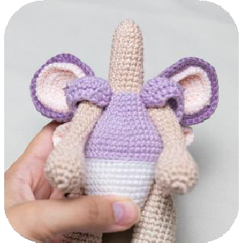 Attaching head to neck of doll