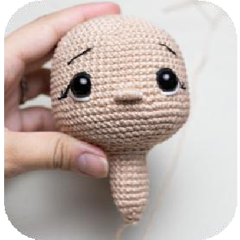 Securing safety eyes on amigurumi doll