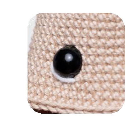 Eyes placed on crochet head