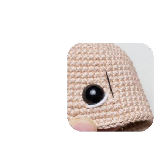 Close up of safety eyes on doll's head