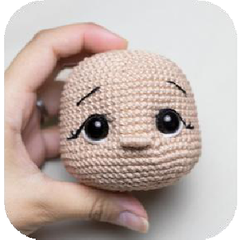 Marking eyebrow positions on doll