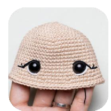 Finished head with cinched and embroidered features