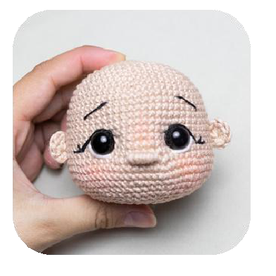 Both ears attached to the doll's head