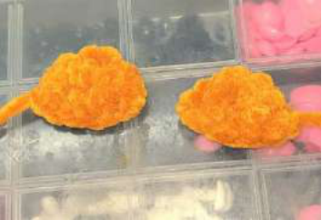 Two finished crocheted legs for the bear.