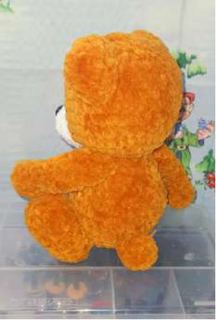 Finished face with embroidered eyebrows and mouth.