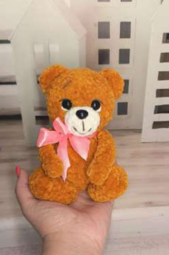 Front view of the finished crochet teddy bear.