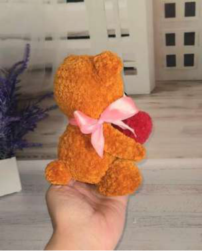 Side view of the finished crochet teddy bear.