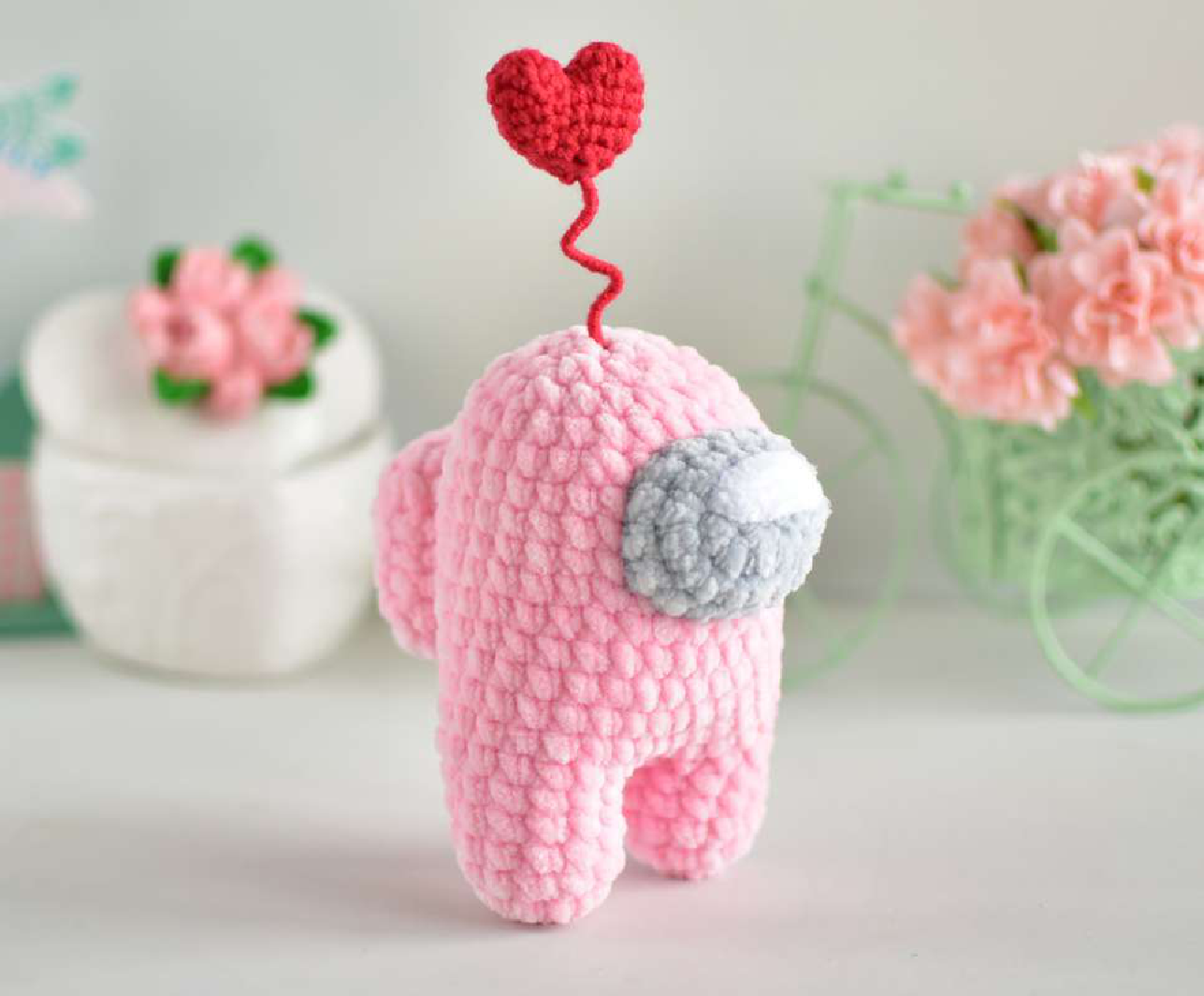 Finished crochet heart cosmonaut amigurumi