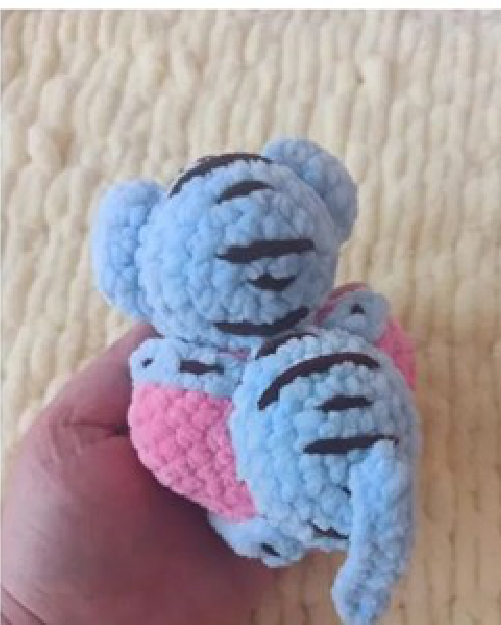 Assembling all the crochet pieces to create the final animal heart.