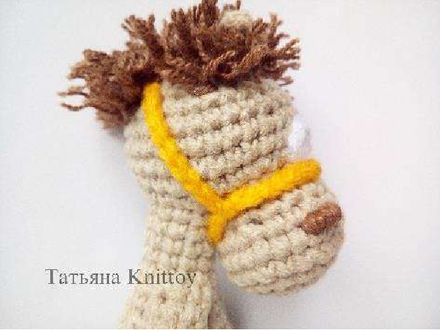 Another view of boy pony with bridle