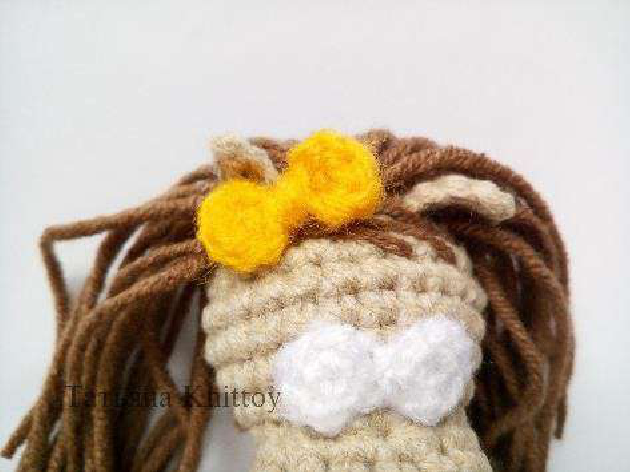 Close-up of bow on girl pony