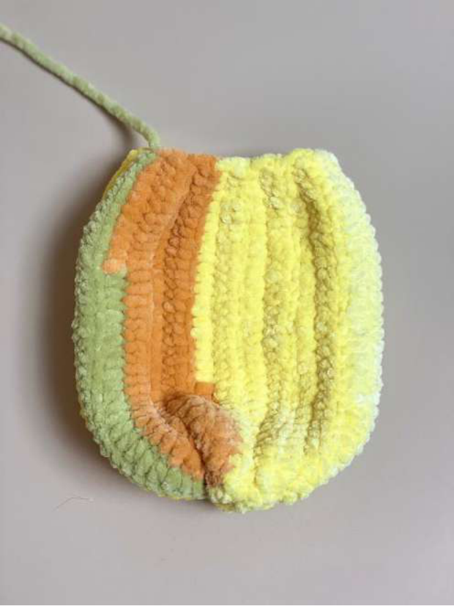 Cinching the bottom of the pumpkin