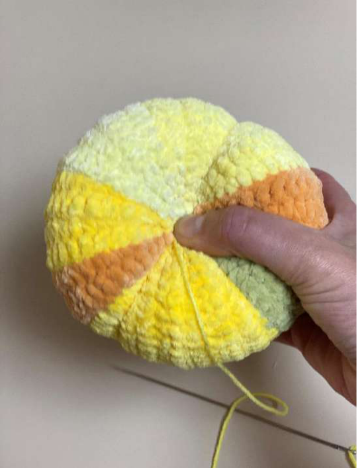 Starting the vertical cinches on the pumpkin