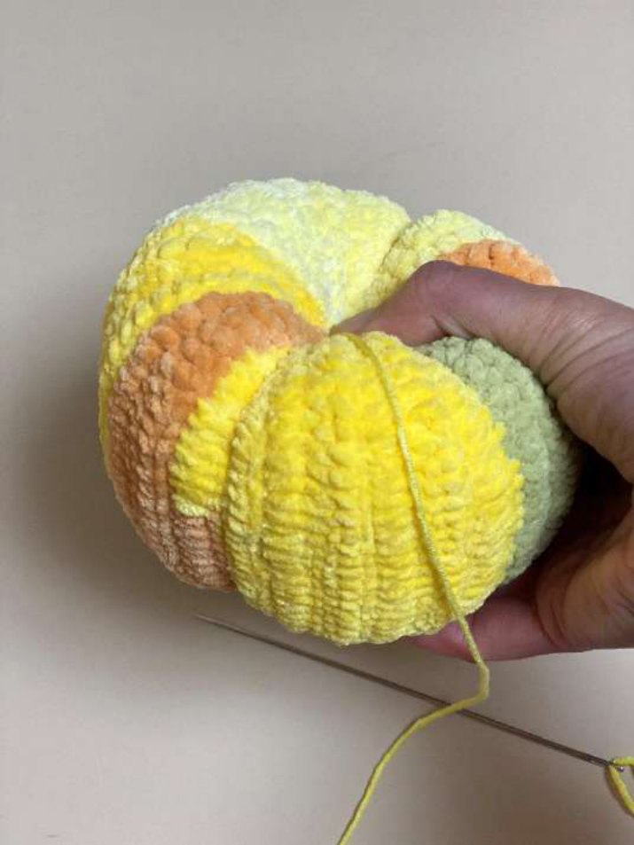 Vertical cinches in progress on the pumpkin