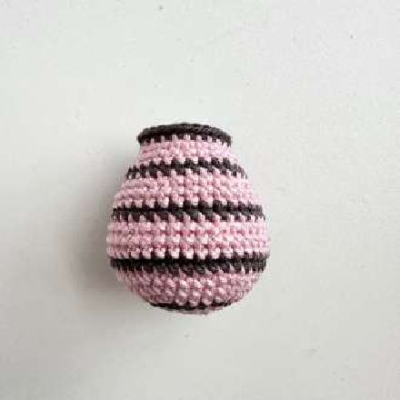 Crocheted piglet body with striped pattern
