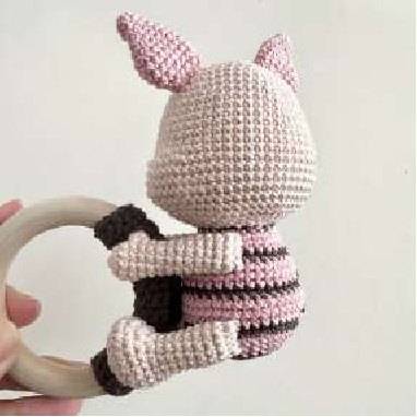 Back view of the assembled crocheted piglet rattle