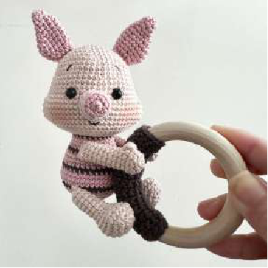 Front view of the assembled crocheted piglet rattle